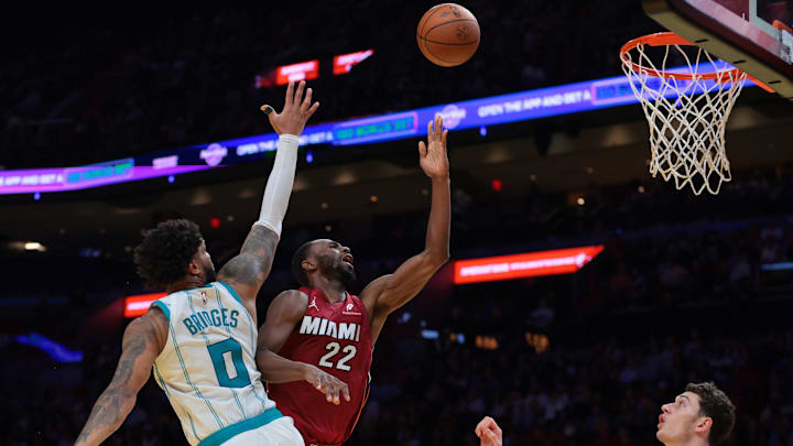 Nov 7, 2025; Miami, Florida, USA; Miami Heat forward Andrew Wiggins (22) drives to the basket against Charlotte Hornets forward Miles Bridges (0) during the third quarter of an NBA Cup game at Kaseya Center. Mandatory Credit: Sam Navarro-Imagn Images