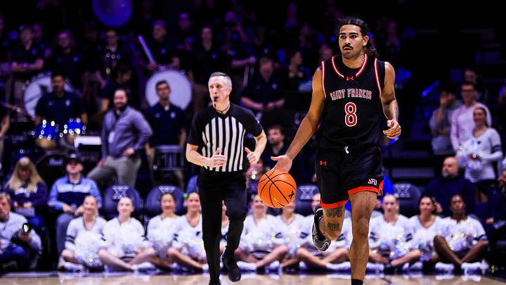 Dec 1, 2025; Cincinnati, Ohio, USA; Saint Francis Red Flash guard Skylar Wicks (8) dribbles against the Xavier Musketeers in the first half at Cintas Center. Dec 1, 2025; Cincinnati, Ohio, USA; Saint Francis Red Flash guard Skylar Wicks (8) dribbles against the Xavier Musketeers in the first half at Cintas Center.