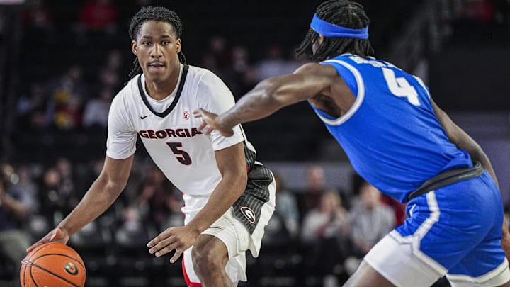 Dec 19, 2024; Athens, Georgia, USA; Georgia Bulldogs guard Silas Demary Jr. (5) dribbles against Buffalo Bulls guard Anquan Boldin Jr. (4) during the first half at Stegeman Coliseum. Mandatory Credit: Dale Zanine-Imagn Images