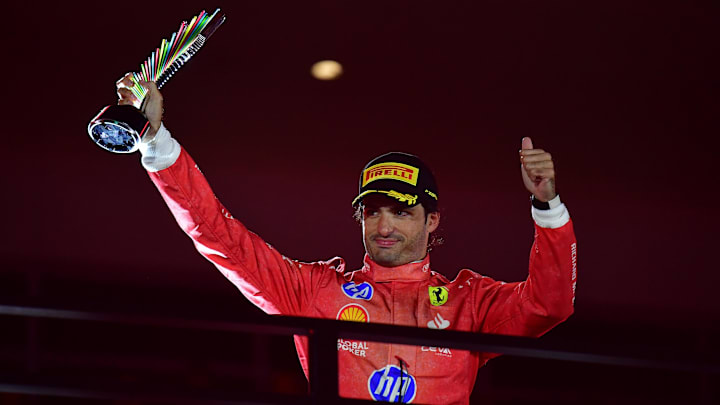 Nov 23, 2024; Las Vegas, Nevada, USA; Scuderia Ferrari driver Carlos Sainz (55) celebrates after placing third in the Las Vegas Grand Prix at Las Vegas Circuit. Mandatory Credit: Gary A. Vasquez-Imagn Images
