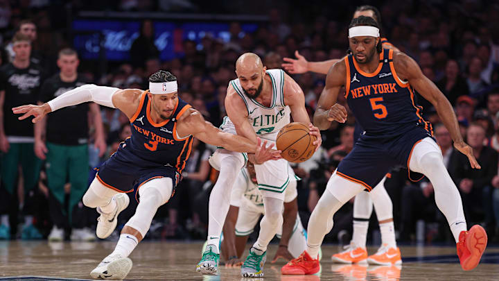 May 12, 2025; New York, New York, USA; New York Knicks guard Josh Hart (3) and Boston Celtics guard Derrick White (9) and forward Precious Achiuwa (5) battle for the ball in the first half during game four of the second round for the 2025 NBA Playoffs at Madison Square Garden. Mandatory Credit: Vincent Carchietta-Imagn Images
