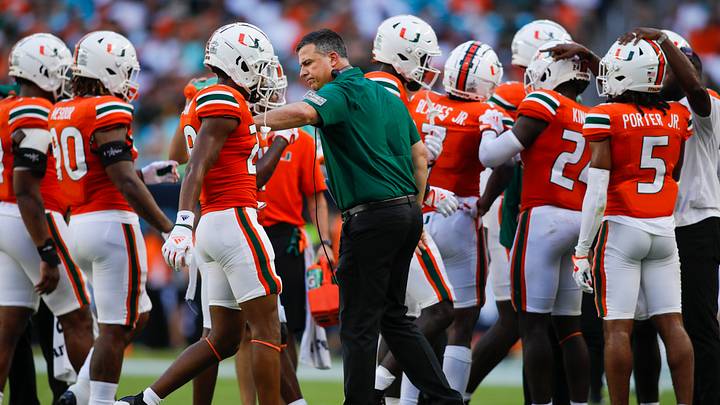 Sep 3, 2022; Miami Gardens, Florida, USA; Miami Hurricanes head coach Mario Cristobal welcomes his players on the sideline during the second quarter against the Bethune Cookman Wildcats at Hard Rock Stadium. Mandatory Credit: Sam Navarro-USA TODAY Sports Sep 3, 2022; Miami Gardens, Florida, USA; Miami Hurricanes head coach Mario Cristobal welcomes his players on the sideline during the second quarter against the Bethune Cookman Wildcats at Hard Rock Stadium. Mandatory Credit: Sam Navarro-USA TODAY Sports
