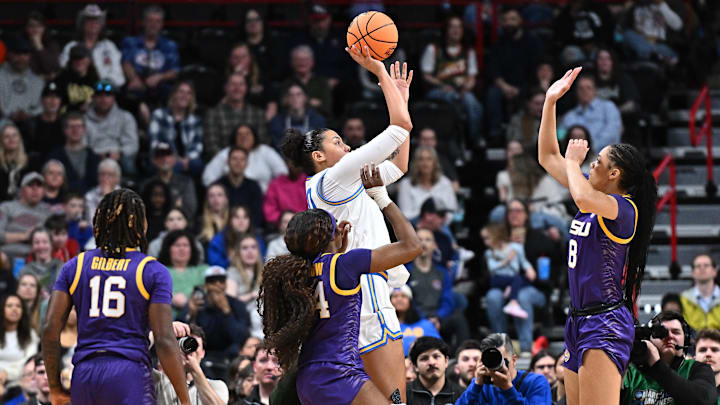 Mar 30, 2025; Spokane, WA, USA; UCLA Bruins forward Timea Gardiner (30) shoots against LSU Lady Tigers forward Jersey Wolfenbarger (8) during the first half of a Elite 8 NCAA Tournament basketball game at Spokane Arena. Mandatory Credit: James Snook-Imagn Images