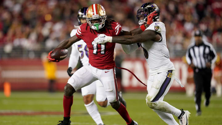 San Francisco 49ers wide receiver Brandon Aiyuk (11) runs with the ball next to Baltimore Ravens linebacker Patrick Queen (6) in the fourth quarter at Levi's Stadium. San Francisco 49ers wide receiver Brandon Aiyuk (11) runs with the ball next to Baltimore Ravens linebacker Patrick Queen (6) in the fourth quarter at Levi's Stadium.