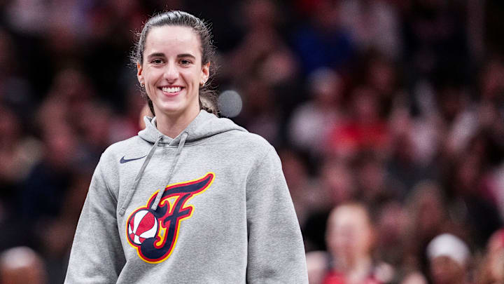 Indiana Fever Caitlin Clark (22) smiles Saturday, May 3, 2025, during a timeout at a preseason game between the Indiana Fever and the Washington Mystics at Gainbridge Fieldhouse in Indianapolis.