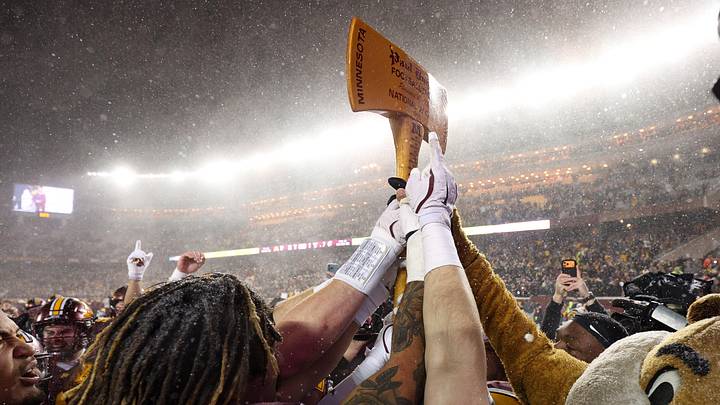 Nov 29, 2025; Minneapolis, Minnesota, USA; Minnesota Golden Gophers celebrate with Paul Bunyan’s Axe after the game against the Wisconsin Badgers at Huntington Bank Stadium. Mandatory Credit: Matt Krohn-Imagn Images
