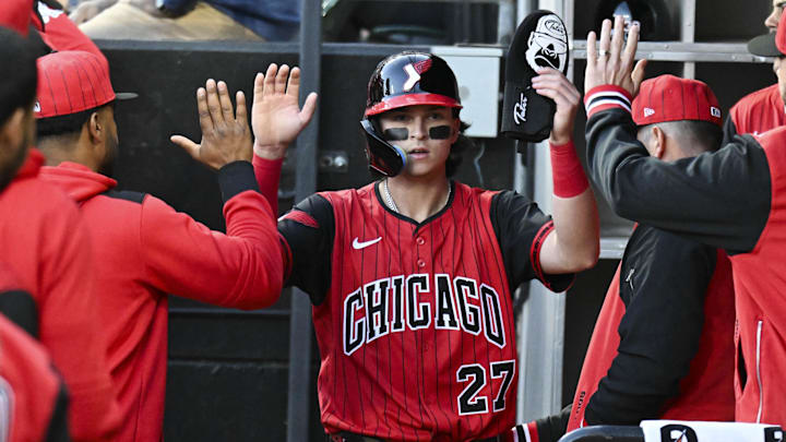 Chicago White Sox outfielder Brooks Baldwin (27) celebrates in the dugout at Rate Field. 