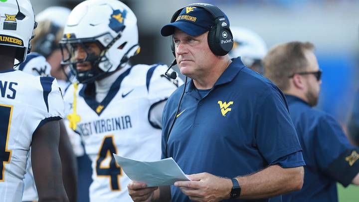 West Virginia Mountaineers head coach Rich Rodriguez looks at plays during the first half of the game against Kansas Jayhawks at David Booth Kansas Memorial Stadium on Sept. 20, 2025. West Virginia Mountaineers head coach Rich Rodriguez looks at plays during the first half of the game against Kansas Jayhawks at David Booth Kansas Memorial Stadium on Sept. 20, 2025.