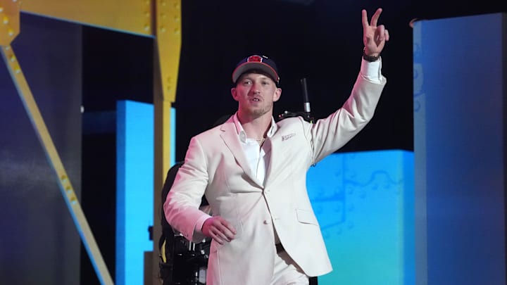 Oregon safety Dillon Thieneman celebrates being the 25th pick in Round 1 by the Bears.