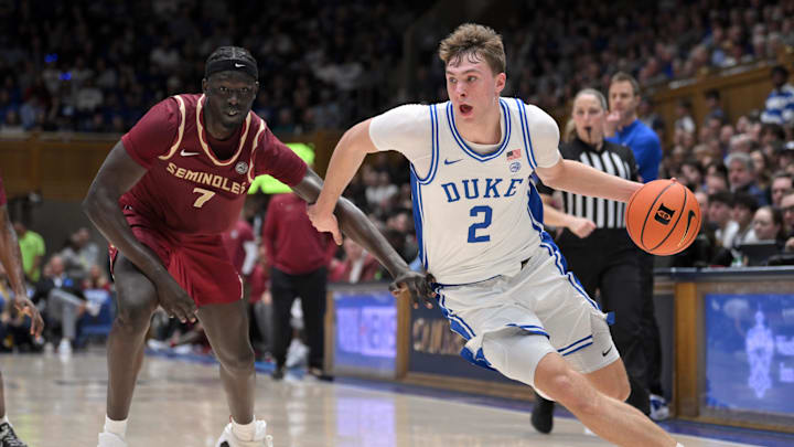 Mar 1, 2025; Durham, North Carolina, USA; Duke Blue Devils forward Cooper Flagg (2) breaks around Florida State Seminoles forward Jerry Deng (7) during the second half at Cameron Indoor Stadium.  Blue Devils won 100-65. Mandatory Credit: Zachary Taft-Imagn Images