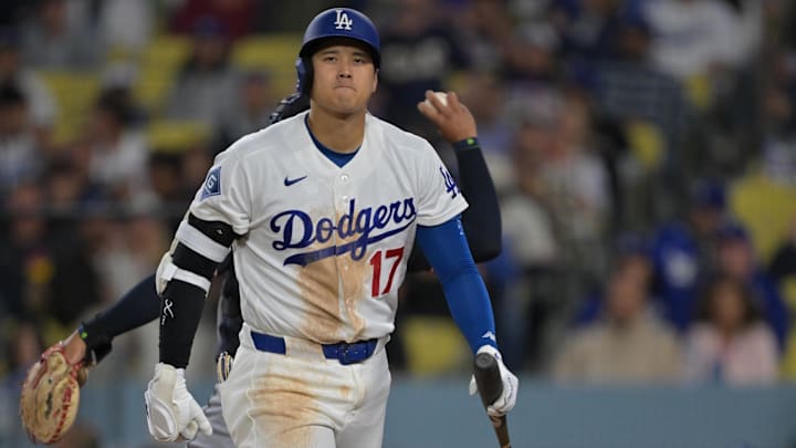 Apr 1, 2026; Los Angeles, California, USA; Los Angeles Dodgers two-way player Shohei Ohtani (17) returns to the dugout after he was called out on a checked swing with bases loaded to end in the eighth inning against the Cleveland Guardians at Dodger Stadium. Mandatory Credit: Jayne Kamin-Oncea-Imagn Images Apr 1, 2026; Los Angeles, California, USA; Los Angeles Dodgers two-way player Shohei Ohtani (17) returns to the dugout after he was called out on a checked swing with bases loaded to end in the eighth inning against the Cleveland Guardians at Dodger Stadium. Mandatory Credit: Jayne Kamin-Oncea-Imagn Images