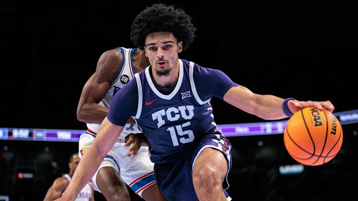 Mar 12, 2026; Kansas City, MO, USA; TCU Horned Frogs forward David Punch (15) drives to the basket during the second half against the Kansas Jayhawks at T-Mobile Center. Mandatory Credit: William Purnell-Imagn Images