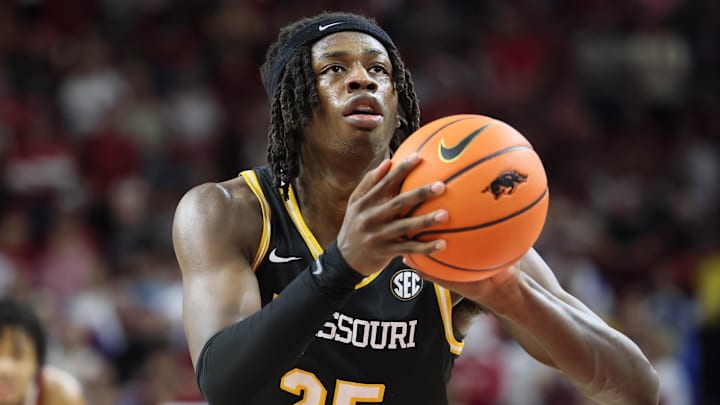 Feb 22, 2025; Fayetteville, Arkansas, USA; Missouri Tigers forward Mark Mitchell (25) shoots a free throw during the second half against the Arkansas Razorbacks at Bud Walton Arena. Mandatory Credit: Nelson Chenault-Imagn Images