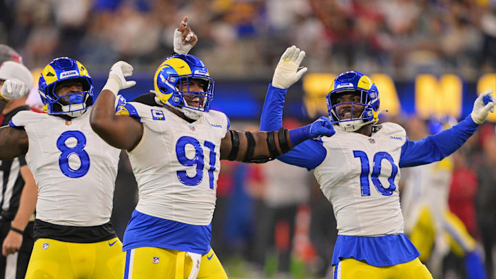 Nov 23, 2025; Inglewood, California, USA; Los Angeles Rams defensive end Kobie Turner (91) celebrates with linebackers Jared Verse (8) and Josaiah Stewart (10) after sacking Tampa Bay Buccaneers quarterback Baker Mayfield (not pictured) during the second quarter at SoFi Stadium. Mandatory Credit: Jayne Kamin-Oncea-Imagn Images Nov 23, 2025; Inglewood, California, USA; Los Angeles Rams defensive end Kobie Turner (91) celebrates with linebackers Jared Verse (8) and Josaiah Stewart (10) after sacking Tampa Bay Buccaneers quarterback Baker Mayfield (not pictured) during the second quarter at SoFi Stadium. Mandatory Credit: Jayne Kamin-Oncea-Imagn Images