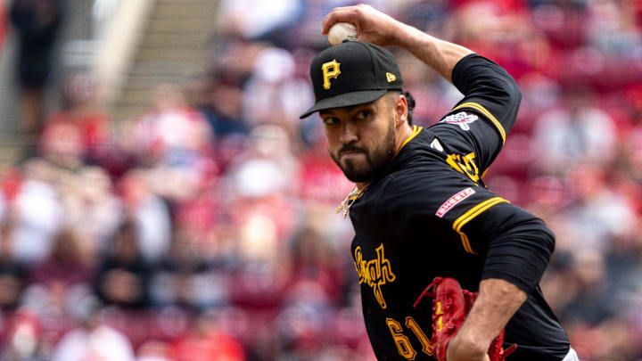 Pittsburgh Pirates pitcher Justin Lawrence (61) throws a pitch in the sixth inning of the MLB game between the Cincinnati Reds and the Pittsburgh Pirates at Great American Ball Park in Cincinnati on Sunday, April 13, 2025. Pittsburgh Pirates pitcher Justin Lawrence (61) throws a pitch in the sixth inning of the MLB game between the Cincinnati Reds and the Pittsburgh Pirates at Great American Ball Park in Cincinnati on Sunday, April 13, 2025.