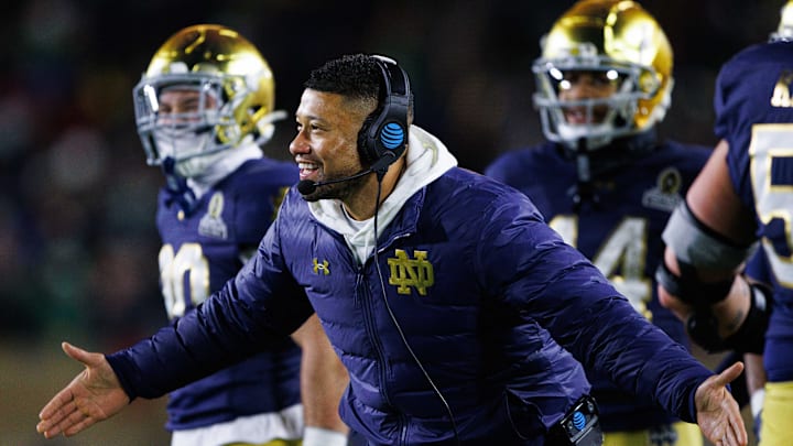 Notre Dame head coach Marcus Freeman celebrates a touchdown scored during the first round of the College Football Playoff between Notre Dame and Indiana University at Notre Dame Stadium on Friday, Dec. 20, 2024, in South Bend.