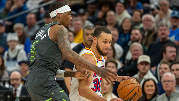 Golden State Warriors guard Stephen Curry dribbles the ball against Minnesota Timberwolves forward Jaden McDaniels in the second half at Target Center in Minneapolis on Jan. 15, 2025. Golden State Warriors guard Stephen Curry dribbles the ball against Minnesota Timberwolves forward Jaden McDaniels in the second half at Target Center in Minneapolis on Jan. 15, 2025.