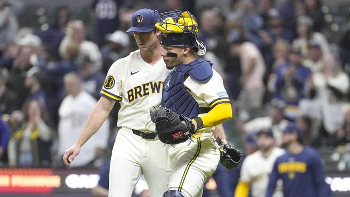 Apr 28, 2026; Milwaukee, Wisconsin, USA; Milwaukee Brewers pitcher Jake Woodford (41) and catcher William Contreras (24) celebrate a 13-2 win over the Arizona Diamondbacks at American Family Field. Mandatory Credit: Michael McLoone-Imagn Images