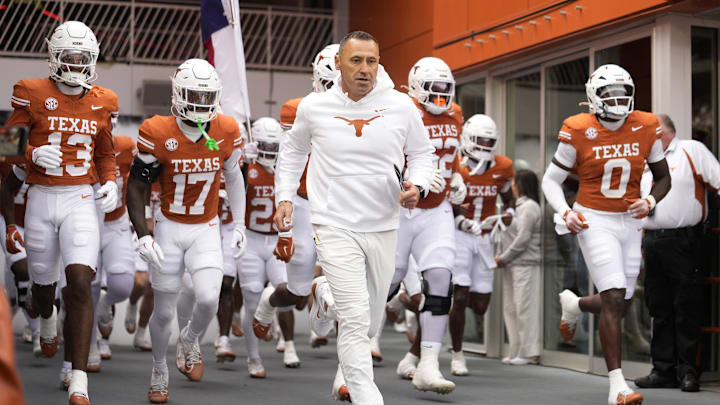 Texas Longhorns head coach Steve Sarkisian leads his team on to the field before a game against the Vanderbilt Commodores at Darrell K Royal-Texas Memorial Stadium.