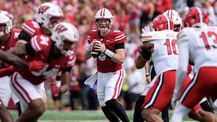 Sep 20, 2025; Madison, Wisconsin, USA;  Wisconsin Badgers quarterback Billy Edwards Jr. (9) looks to throw a pass during the first quarter against the Maryland Terrapins at Camp Randall Stadium. 