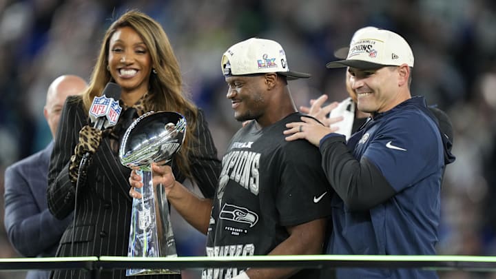 Feb 8, 2026; Santa Clara, CA, USA; Seattle Seahawks head coach Mike MacDonald and running back Kenneth Walker III (9) celebrate with the Vince Lombardi trophy after defeating the New England Patriots in Super Bowl LX at Levi's Stadium.  Mandatory Credit: Kyle Terada-Imagn Images