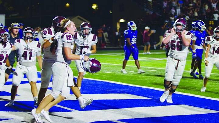 Benton (Arkansas) players swarm around quarterback Chase Cobb (12) after Cobb caught a game-winning two-point conversion pass in a 43-42 win against arch-rival Bryant on Aug. 28, 2026. Benton (Arkansas) players swarm around quarterback Chase Cobb (12) after Cobb caught a game-winning two-point conversion pass in a 43-42 win against arch-rival Bryant on Aug. 28, 2026.