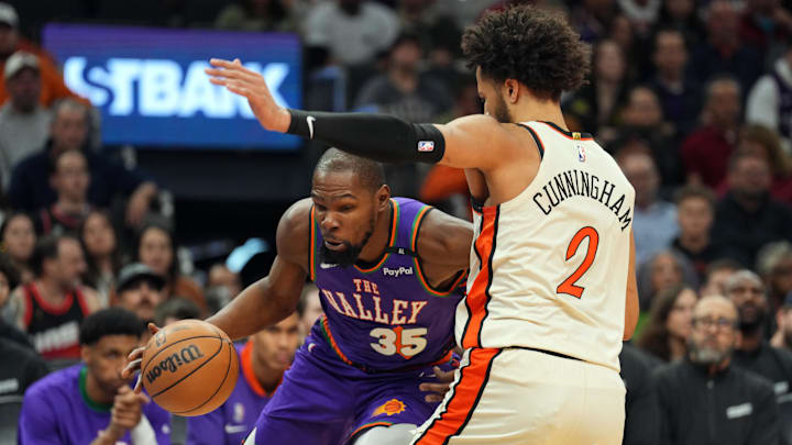 Dec 21, 2024; Phoenix, Arizona, USA; Phoenix Suns forward Kevin Durant (35) drives against Detroit Pistons guard Cade Cunningham (2) during the first half at Footprint Center. Mandatory Credit: Joe Camporeale-Imagn Images Dec 21, 2024; Phoenix, Arizona, USA; Phoenix Suns forward Kevin Durant (35) drives against Detroit Pistons guard Cade Cunningham (2) during the first half at Footprint Center. Mandatory Credit: Joe Camporeale-Imagn Images