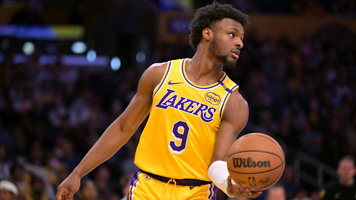 Mar 19, 2025; Los Angeles, California, USA;  Los Angeles Lakers guard Bronny James (9) inbound the ball in the second half against the Denver Nuggets at Crypto.com Arena. 