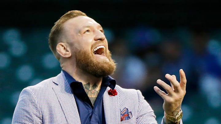 Sep 21, 2021; Chicago, Illinois, USA; MMA fighter Conor McGregor tosses the ball after throwing out the first pitch. Sep 21, 2021; Chicago, Illinois, USA; MMA fighter Conor McGregor tosses the ball after throwing out the first pitch.