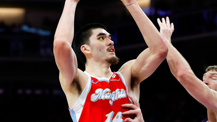 Jan 3, 2025; Sacramento, California, USA; Memphis Grizzlies center Zach Edey (14) shoots the ball against Sacramento Kings forward Domantas Sabonis (11) during the third quarter at Golden 1 Center. Mandatory Credit: Sergio Estrada-Imagn Images Jan 3, 2025; Sacramento, California, USA; Memphis Grizzlies center Zach Edey (14) shoots the ball against Sacramento Kings forward Domantas Sabonis (11) during the third quarter at Golden 1 Center. Mandatory Credit: Sergio Estrada-Imagn Images