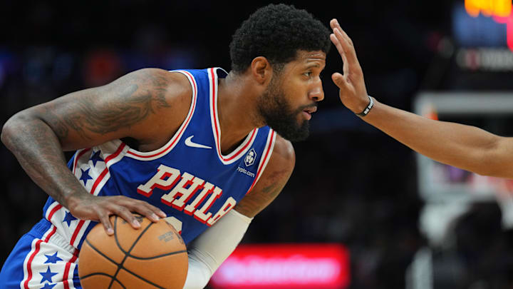 Nov 4, 2024; Phoenix, Arizona, USA; Philadelphia 76ers forward Paul George (8) protects the ball against the Phoenix Suns during the first half at Footprint Center. Mandatory Credit: Joe Camporeale-Imagn Images