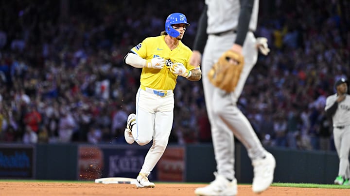 Sep 13, 2025; Boston, Massachusetts, USA; Boston Red Sox outfielder Jarren Duran (16) unbuttons his jersey to partially display his t-shirt after hitting a one-run home run during the eighth inning against the New York Yankees at Fenway Park. Mandatory Credit: Eric Canha-Imagn Images
