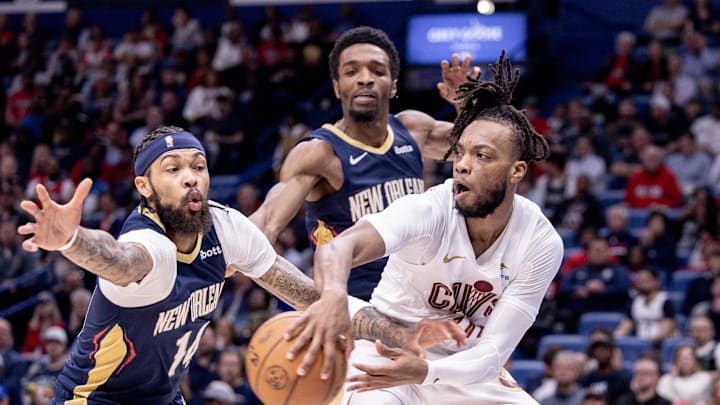 Mar 13, 2024; New Orleans, Louisiana, USA; Cleveland Cavaliers guard Darius Garland (10) looks to pass the ball against New Orleans Pelicans forward Brandon Ingram (14) during the first half at Smoothie King Center. Mandatory Credit: Stephen Lew-Imagn Images Mar 13, 2024; New Orleans, Louisiana, USA; Cleveland Cavaliers guard Darius Garland (10) looks to pass the ball against New Orleans Pelicans forward Brandon Ingram (14) during the first half at Smoothie King Center. Mandatory Credit: Stephen Lew-Imagn Images