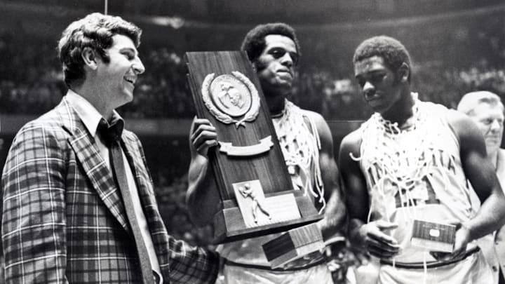 Mar 29, 1976; Philadelphia, PA, USA; FILE PHOTO; Indiana head coach Bobby Knight celebrates with forward Scott May (center) and guard Quinn Buckner (21) after winning the 1976 NCAA basketball championship. The Hoosiers beat the Wolverines 86-68.  