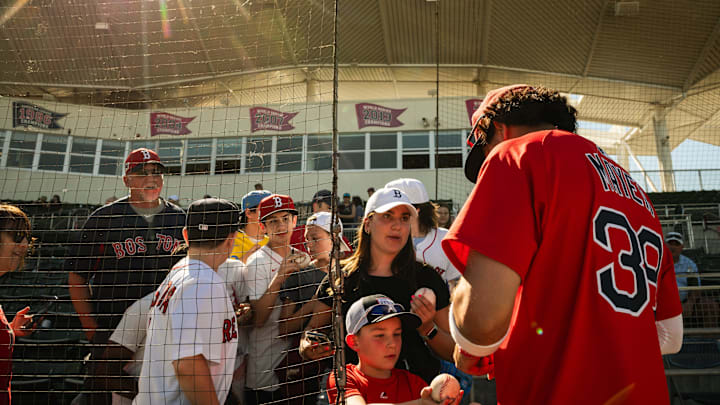Red Sox prospect Marcelo Mayer signs autographs following a Spring Training game at JetBlue Park on March 11, 2025.