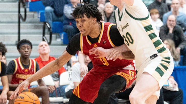Feb 21, 2025; Hackensack, NJ, USA; St. Joseph vs. Bergen Catholic in the 68th Bergen County Jamboree boys basketball championship at Fairleigh Dickinson. BC #0 Julius Avent tries to get past SJ #30 Tom Diomedi.