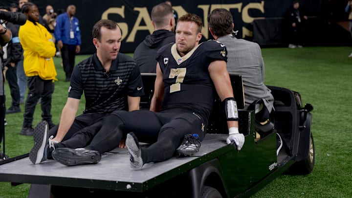 Dec 1, 2024; New Orleans, Louisiana, USA; New Orleans Saints tight end Taysom Hill (7) leaves the field after an injury against the Los Angeles Rams during the second half at Caesars Superdome. Mandatory Credit: Matthew Hinton-Imagn Images Dec 1, 2024; New Orleans, Louisiana, USA; New Orleans Saints tight end Taysom Hill (7) leaves the field after an injury against the Los Angeles Rams during the second half at Caesars Superdome. Mandatory Credit: Matthew Hinton-Imagn Images