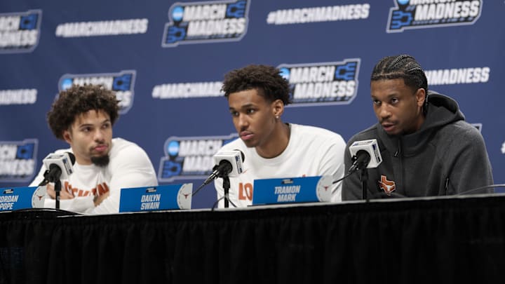 Mar 18, 2026; Portland, OR, USA; Texas Longhorns guard Tramon Mark (12), forward Dailyn Swain (3), and guard Jordan Pope (0), answer questions at a press conference.