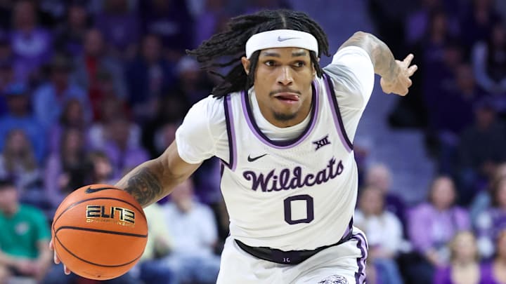 Feb 8, 2025; Manhattan, Kansas, USA; Kansas State Wildcats guard Dug McDaniel (0) drives to the basket during the first half against the Kansas Jayhawks at Bramlage Coliseum. Mandatory Credit: Scott Sewell-Imagn Images