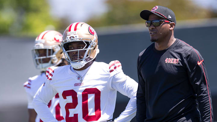 San Francisco 49ers cornerback Upton Stout (L) and defensive backs coach Daniel Bullocks (R) San Francisco 49ers cornerback Upton Stout (L) and defensive backs coach Daniel Bullocks (R)