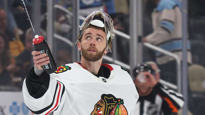 Apr 8, 2025; Pittsburgh, Pennsylvania, USA;  Chicago Blackhawks goaltender Spencer Knight (30) squirts water during a time-out against the Pittsburgh Penguins in the third period at PPG Paints Arena. Mandatory Credit: Charles LeClaire-Imagn Images