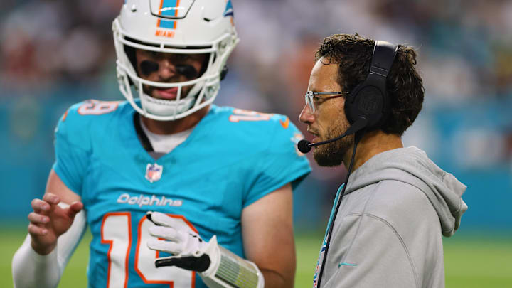 Aug 17, 2024; Miami Gardens, Florida, USA; Miami Dolphins head coach Mike McDaniel talks to quarterback Skylar Thompson (19) on the sideline against the Washington Commanders during the second quarter at Hard Rock Stadium. Aug 17, 2024; Miami Gardens, Florida, USA; Miami Dolphins head coach Mike McDaniel talks to quarterback Skylar Thompson (19) on the sideline against the Washington Commanders during the second quarter at Hard Rock Stadium.