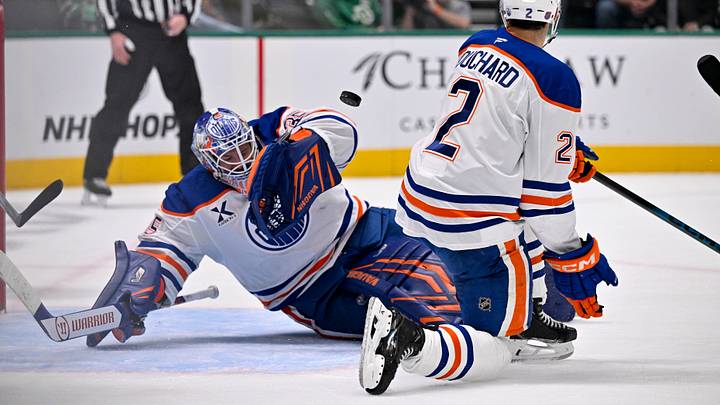 Mar 12, 2026; Dallas, Texas, USA; Edmonton Oilers goaltender Tristan Jarry (35) and defenseman Evan Bouchard (2) stops a Dallas Stars shot during the game between the Stars and the Oilers at the American Airlines Center. Mandatory Credit: Jerome Miron-Imagn Images