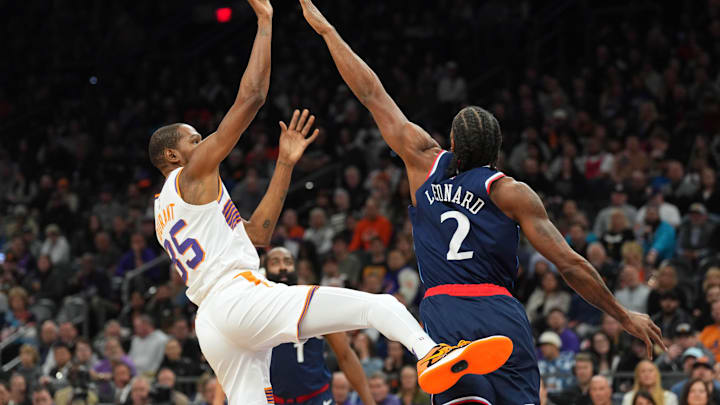 Jan 27, 2025; Phoenix, Arizona, USA; Phoenix Suns forward Kevin Durant (35) shoots over LA Clippers forward Kawhi Leonard (2) during the first half at Footprint Center. Mandatory Credit: Joe Camporeale-Imagn Images