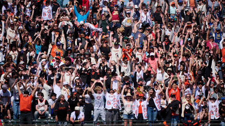  San Francisco, California, USA; San Francisco Giants fans cheer during the eighth inning of the game against the Colorado Rockies at Oracle Park.