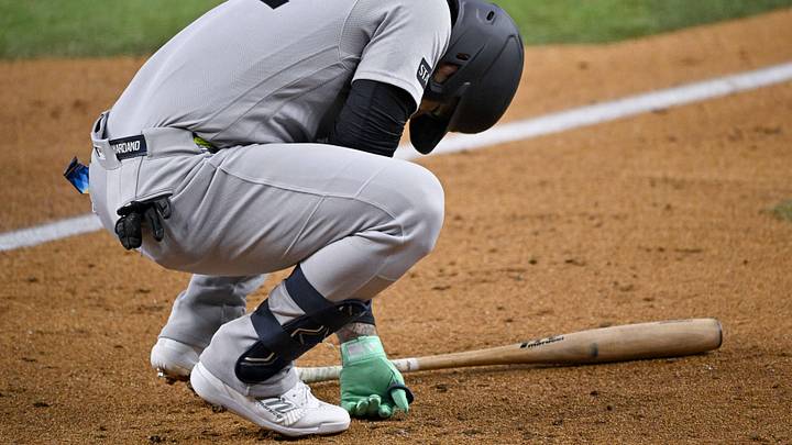 Arlington, Texas, USA; New York Yankees left fielder Jasson Dominguez (24) reacts to being hit by a pitch during the game between the Rangers and the Yankees at Globe Life Field