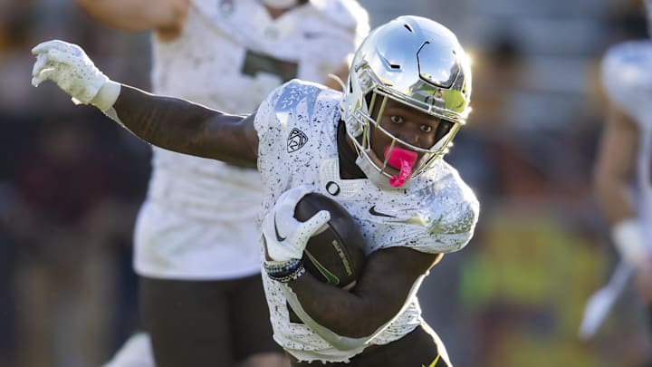 Nov 18, 2023; Tempe, Arizona, USA; Oregon Ducks running back Bucky Irving (0) runs the ball.