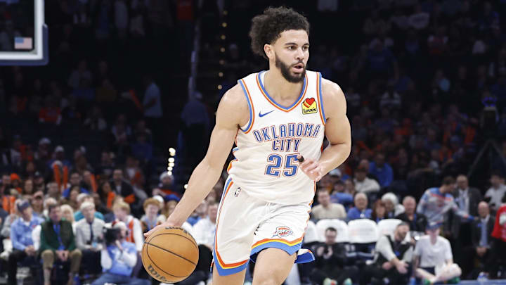 Dec 23, 2024; Oklahoma City, Oklahoma, USA; Oklahoma City Thunder guard Ajay Mitchell (25) dribbles the ball down the court against the Washington Wizards during the second half at Paycom Center.