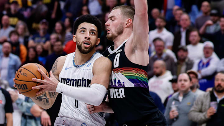 Feb 11, 2026; Denver, Colorado, USA; Memphis Grizzlies guard Scotty Pippen Jr. (1) controls the ball as Denver Nuggets guard Christian Braun (0) guards in the fourth quarter at Ball Arena. Mandatory Credit: Isaiah J. Downing-Imagn Images Feb 11, 2026; Denver, Colorado, USA; Memphis Grizzlies guard Scotty Pippen Jr. (1) controls the ball as Denver Nuggets guard Christian Braun (0) guards in the fourth quarter at Ball Arena. Mandatory Credit: Isaiah J. Downing-Imagn Images
