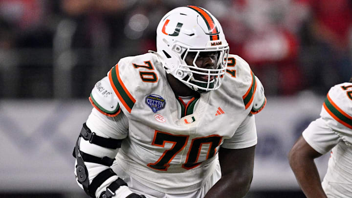 Dec 31, 2025; Arlington, TX, USA; Miami Hurricanes offensive lineman Markel Bell (70) gets into position during the 2025 Cotton Bowl and quarterfinal game of the College Football Playoff.